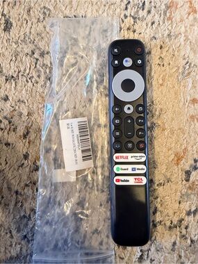 TCL Black Remote with White Navigation Ring and Streaming Shortcuts